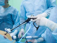 A doctor performing diagnostic laparoscopy